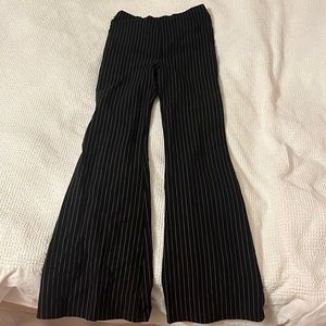 Pinstriped black and white pants.